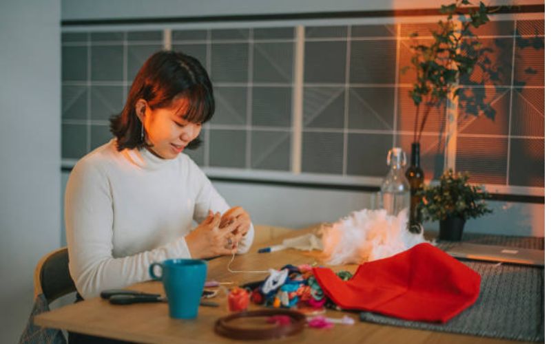 women preparing sequin embroidery 
